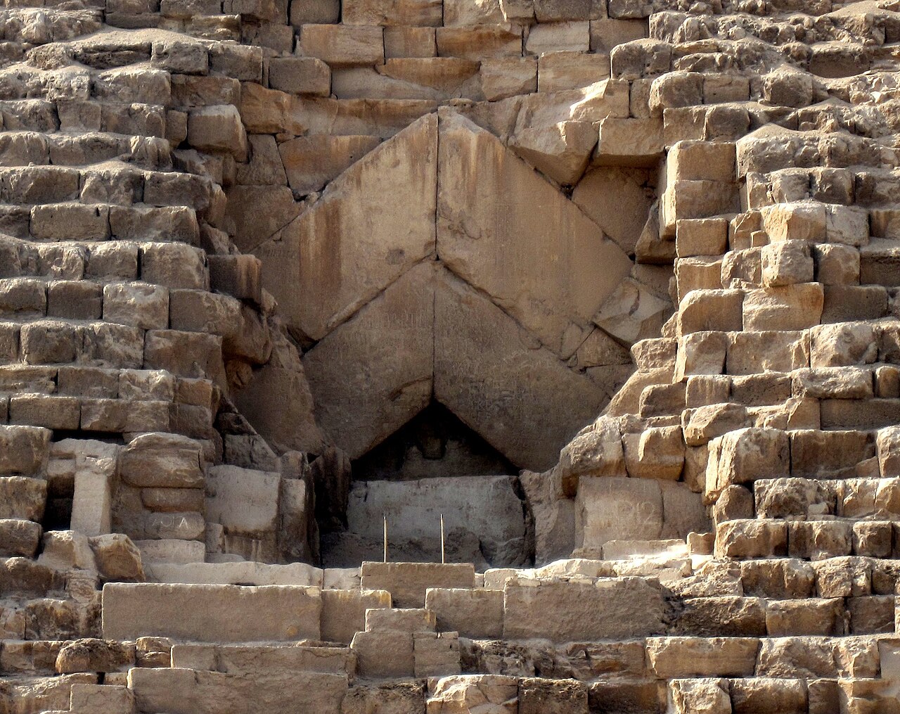 Published photograph of Khufu's surviving original north entrance and chevron stones